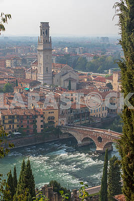 Bridge Ponte Pietra and the bell tower of Verona