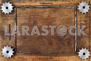 Different construction tools on a wooden background - screwdriver, caliper.