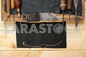 Carpenter tools on wooden table with sawdust. Circular Saw.