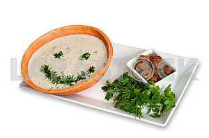 Cream soup with spices on a white background