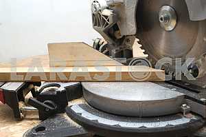 Carpenter tools on wooden table with sawdust. Circular Saw.