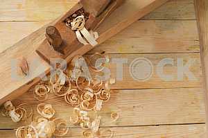 Carpenter tools on wooden table with sawdust. Circular Saw.