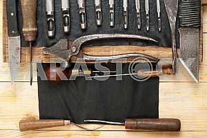 Carpenter tools on wooden table with sawdust. Circular Saw.