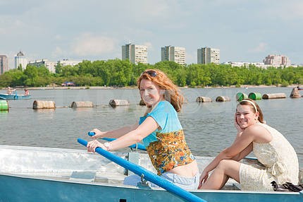 Mom and Daughter relax in boat 