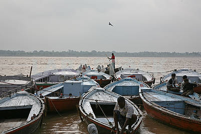 Boats near the shore of the sacred river Ganges.