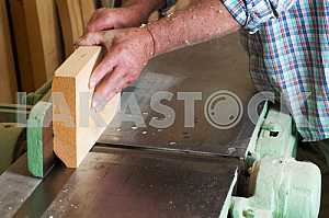 Carpenter tools on wooden table with sawdust. Circular Saw. Carpenter workplace top view