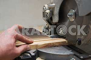 Carpenter tools on wooden table with sawdust. Circular Saw.