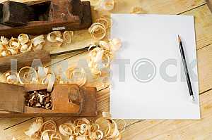 Carpenter tools on wooden table with sawdust. Circular Saw.