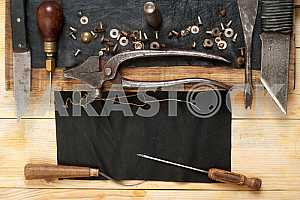Carpenter tools on wooden table with sawdust. Circular Saw.