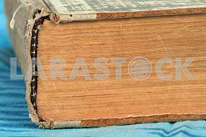 Old and used hardback books or text books on wooden table. Books and reading are essential for self improvement, gaining knowledge and success in our careers, business and personal lives. Copy space