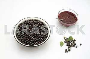 Jam with currant on a white background.