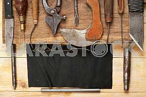 Carpenter tools on wooden table with sawdust. Circular Saw.