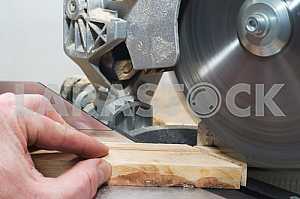 Carpenter tools on wooden table with sawdust. Circular Saw.