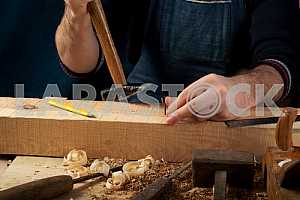 Carpenter tools on wooden table with sawdust. Circular Saw.