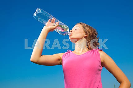 Young woman drinking water outdoor