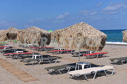thatched umbrellas on the beach