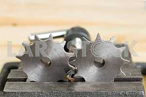 Different construction tools on a wooden background - screwdriver, caliper.