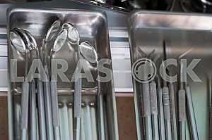 Stomatological instrument in the dentists clinic. Operation, tooth replacement.