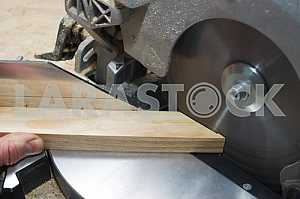 Carpenter tools on wooden table with sawdust. Circular Saw.