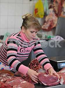 A woman sells meat on the market April 6, 2012