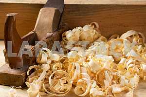 Carpenter tools on wooden table with sawdust. Circular Saw.