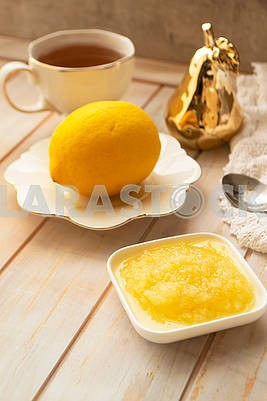 Cup of tea with fresh lemon and ground, medical sujet