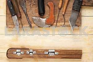 Carpenter tools on wooden table with sawdust. Circular Saw.