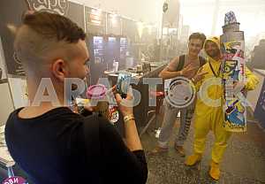 People take pictures at an exhibition