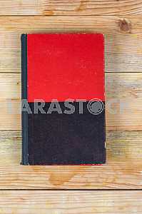 Open book, stack of hardback books on wooden table. Back to school. Copy space