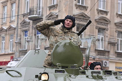 The commander of an armored troop carrier on the march of the defenders of the Fatherland in Lviv