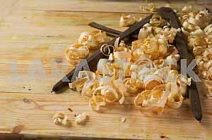 Carpenter tools on wooden table with sawdust. Circular Saw.