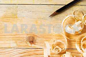 Carpenter tools on wooden table with sawdust. Circular Saw.