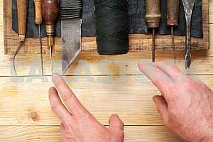 Carpenter tools on wooden table with sawdust. Circular Saw.