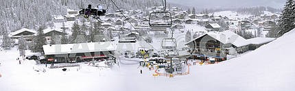 Ski lift and slopes in high mountains