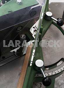 Different construction tools on a wooden background - screwdriver, caliper.