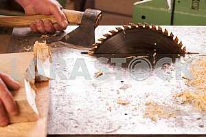Carpenter tools on wooden table with sawdust. Circular Saw. Carpenter workplace top view