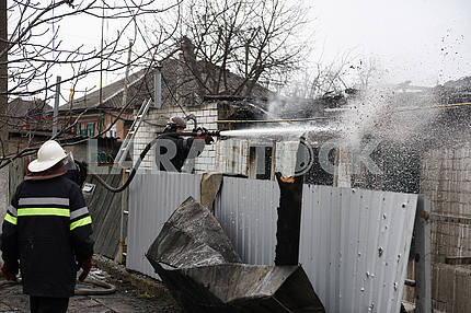 Rescuers extinguish a fire in Balakley