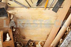 Carpenter tools on wooden table with sawdust. Circular Saw.