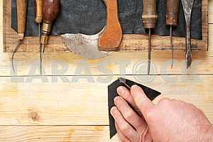 Carpenter tools on wooden table with sawdust. Circular Saw.