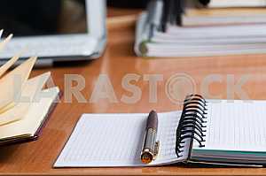 Stack of hardback books on wooden table. Back to school. Copy space. Top view