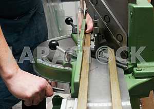 Different construction tools on a wooden background - screwdriver, caliper.