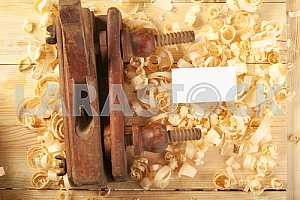 Carpenter tools on wooden table with sawdust. Circular Saw.