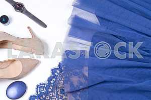 Woman clothes and accessories. Soft blue colors female apparel.