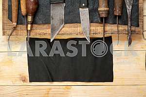 Carpenter tools on wooden table with sawdust. Circular Saw.
