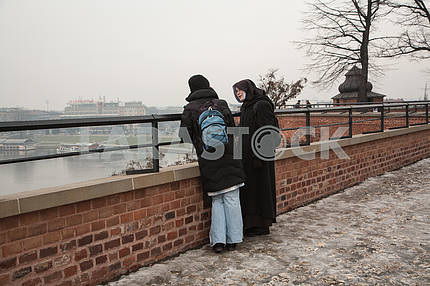 The nun speaks with a parishioner at the Wawel Hill