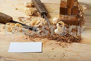 Carpenter tools on wooden table with sawdust. Circular Saw.
