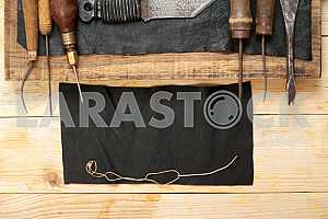 Carpenter tools on wooden table with sawdust. Circular Saw.