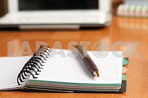 Stack of hardback books on wooden table. Back to school. Copy space. Top view