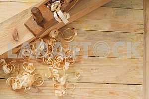 Carpenter tools on wooden table with sawdust. Circular Saw.