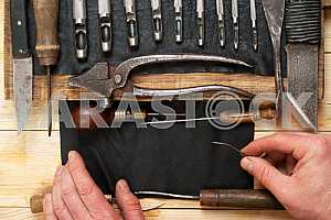 Carpenter tools on wooden table with sawdust. Circular Saw.